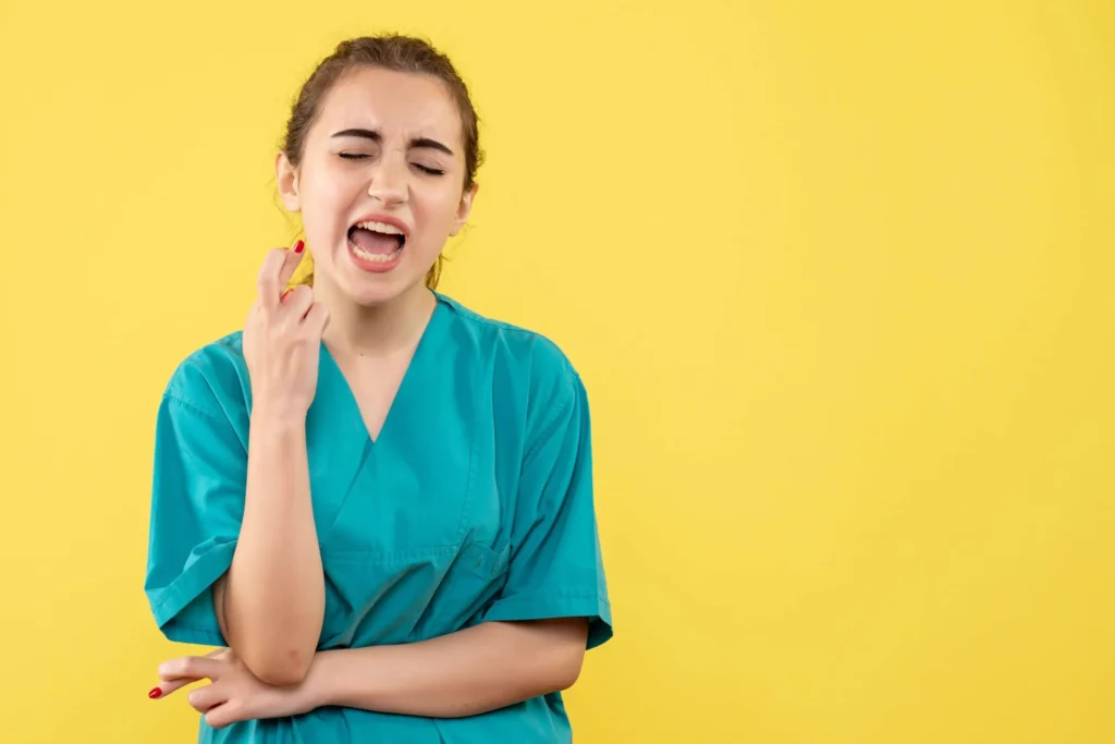 Smiling female dentist at Dr. Kaltio Dental, ready to provide immediate emergency dental care to patients in Richmond, BC